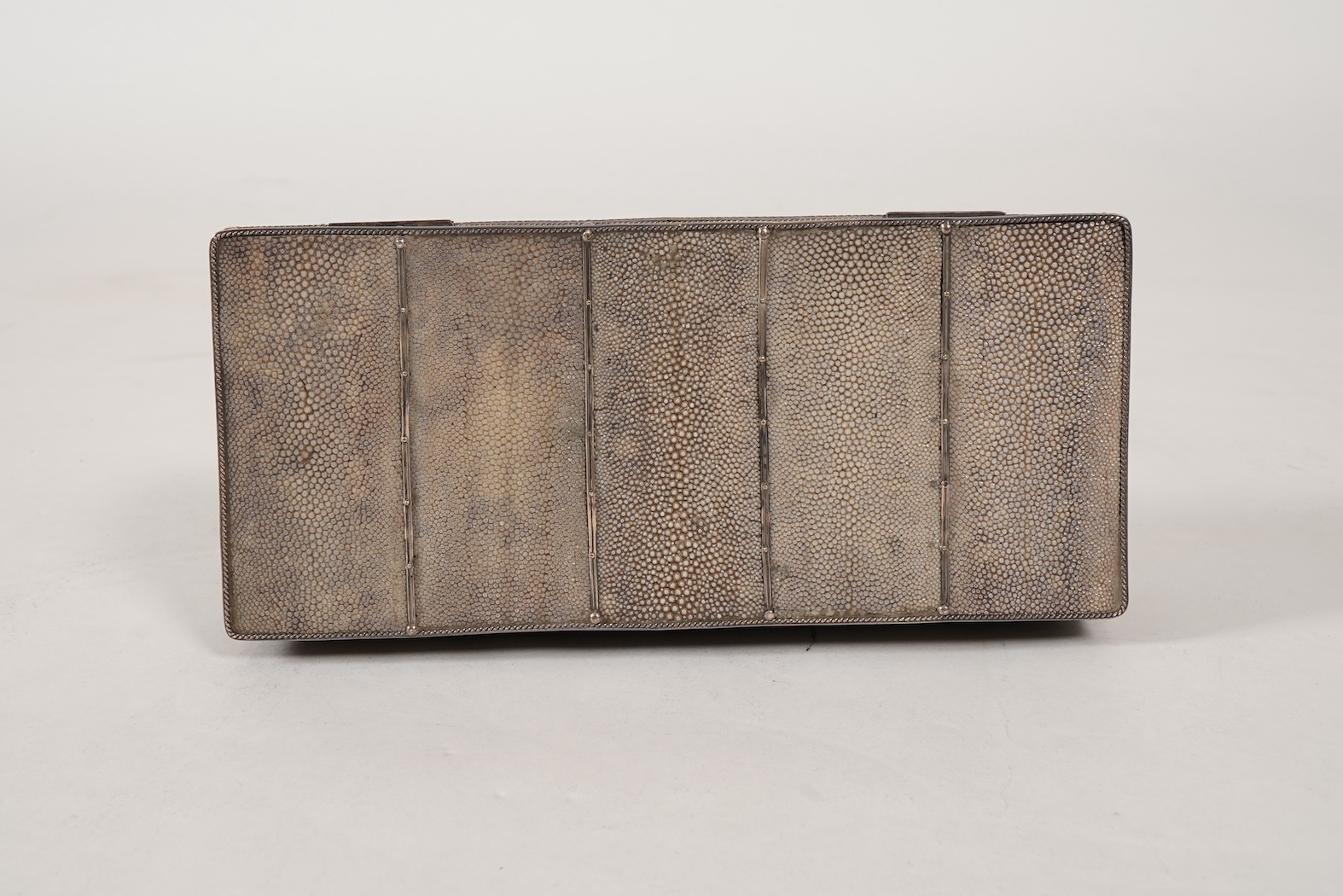 An early 20th century Arts & Crafts silver and shagreen mounted cigarette box with hinged cover, by John Paul Cooper